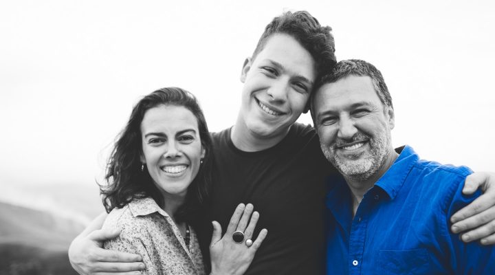 Australian couple embrace their teenage son